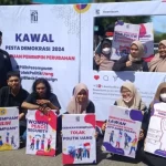Aksi protes Balai Syura Ureung Inong Aceh terkait diskriminasi perempuan dalam partisipasi di Pilkada Aceh. Foto: Dok Balai Syura Ureung Inong Aceh